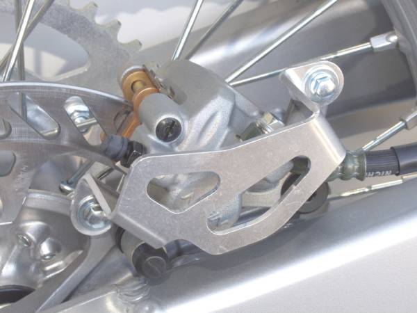 WORKS - ALUM REAR CALIPER GUARD KX/RMZ - Image 1